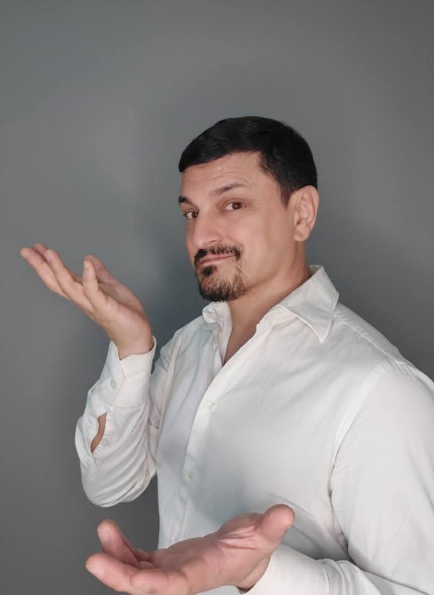 Kuya Manzano, founder of iChill Productions, in a white shirt making a playful presenting gesture