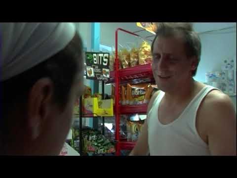 Still from the short film Marriage War (En el amor y en la guerra): two characters talking in a shop